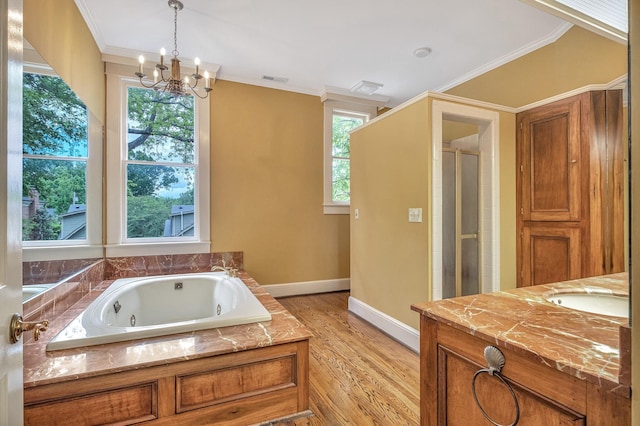 bathroom with ornamental molding, a chandelier, and wood-type flooring