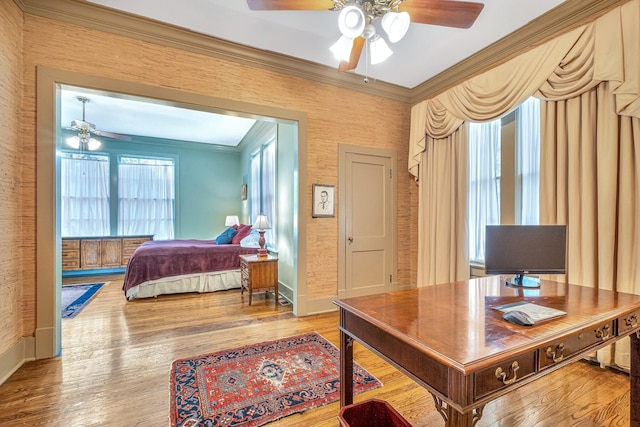 bedroom with ceiling fan, wood-type flooring, and ornamental molding