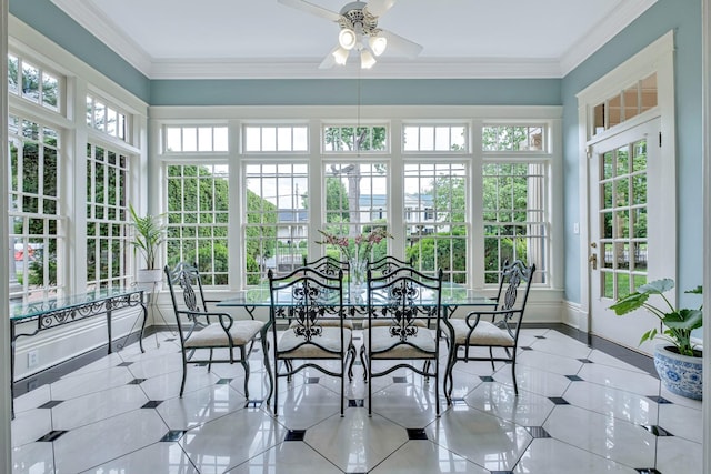 sunroom / solarium featuring ceiling fan