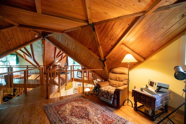 sitting room featuring vaulted ceiling with beams, light hardwood / wood-style flooring, a wealth of natural light, and wood ceiling