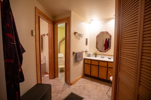 bathroom with vanity and toilet