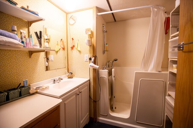 bathroom featuring vanity and walk in shower