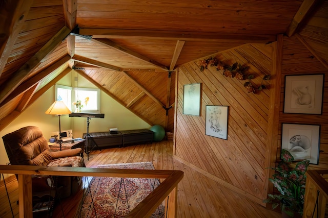 interior space featuring lofted ceiling with beams, wooden walls, wooden ceiling, and hardwood / wood-style flooring