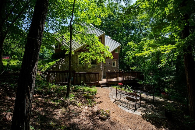 view of yard with a deck and a patio area