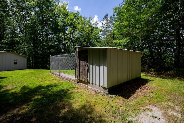 view of outdoor structure with a lawn