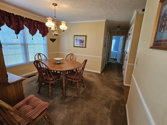 carpeted dining area with an inviting chandelier, a textured ceiling, and ornamental molding