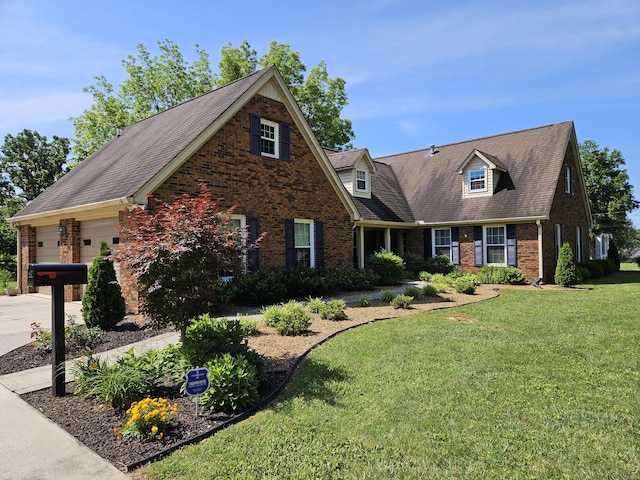 view of front of house featuring a front yard and a garage