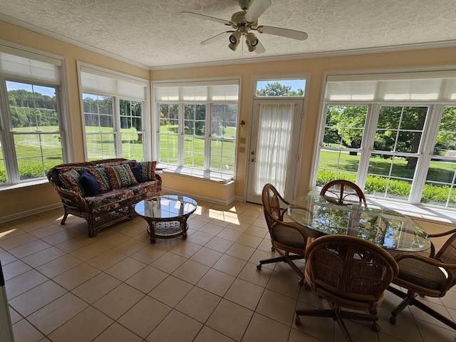 sunroom with plenty of natural light and ceiling fan