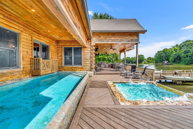 view of swimming pool with a deck with water view