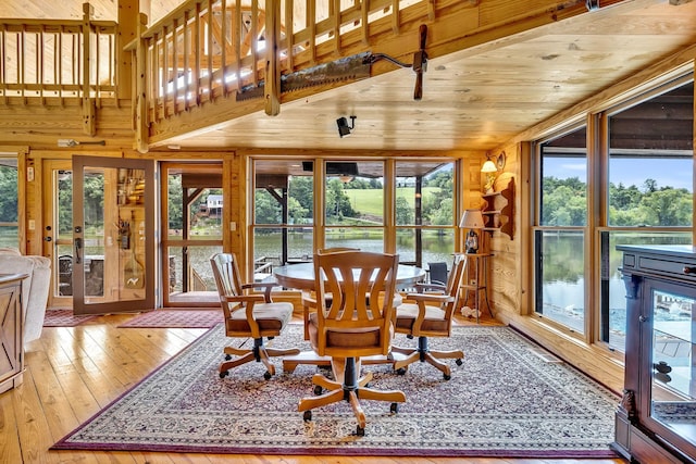 sunroom with french doors, a wealth of natural light, and wood ceiling