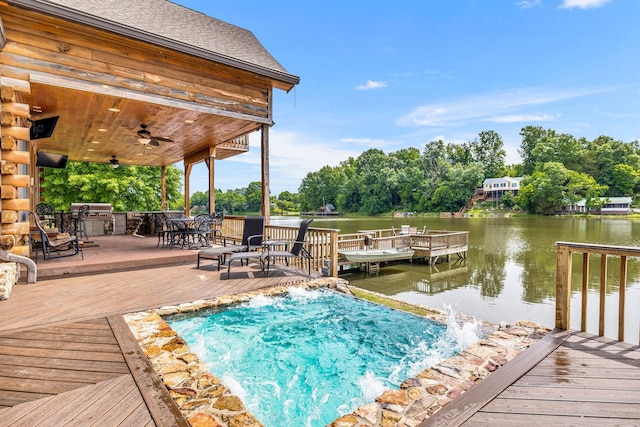 exterior space featuring a deck with water view