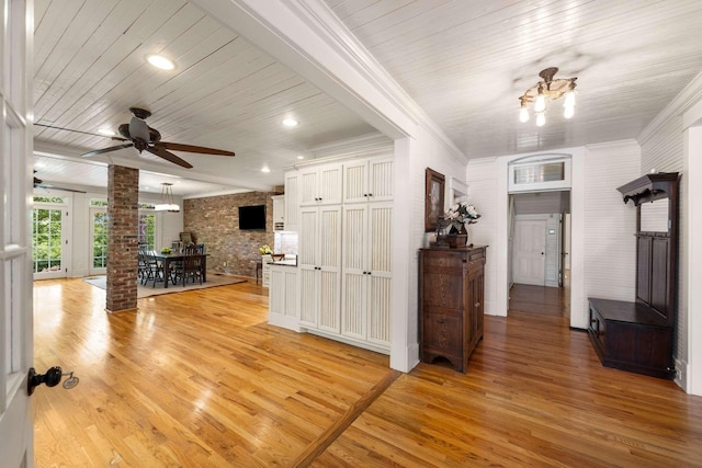 interior space with an inviting chandelier, wood ceiling, light hardwood / wood-style floors, and brick wall