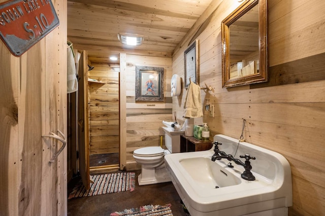 bathroom featuring wood ceiling, wooden walls, and toilet