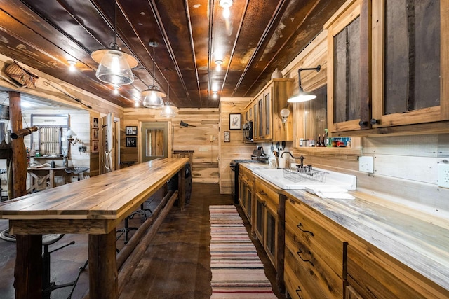 bar with wood ceiling, wooden walls, gas range oven, and hanging light fixtures