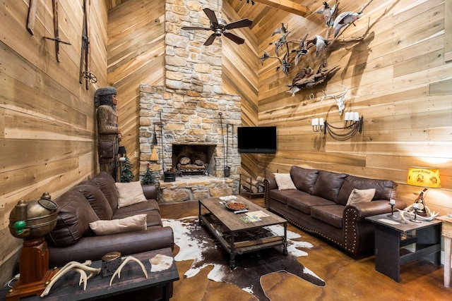 living room with a fireplace, high vaulted ceiling, wooden walls, and ceiling fan