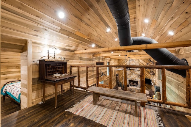 interior space with wood ceiling, dark hardwood / wood-style flooring, and wood walls