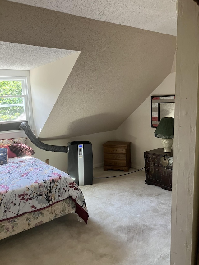 unfurnished bedroom with carpet flooring, a textured ceiling, and vaulted ceiling