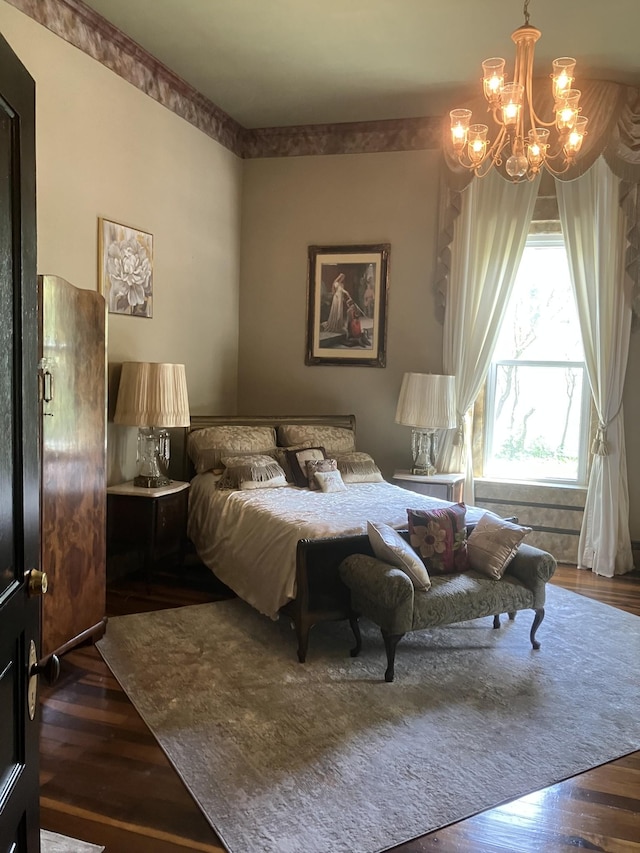 bedroom featuring dark hardwood / wood-style floors and an inviting chandelier