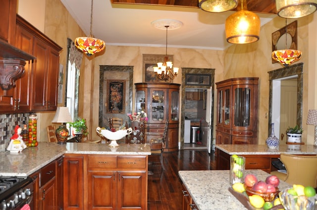 kitchen featuring light stone countertops, tasteful backsplash, hanging light fixtures, and dark wood-type flooring