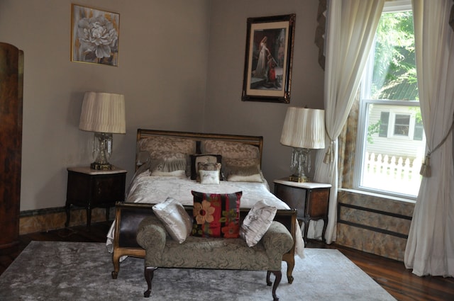 bedroom featuring dark wood-type flooring