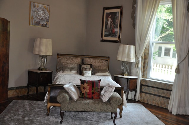 bedroom featuring dark wood-style flooring