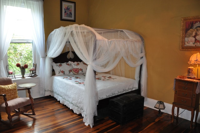 bedroom featuring dark hardwood / wood-style flooring