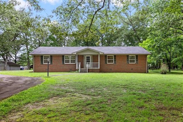 ranch-style house featuring a porch and a front lawn