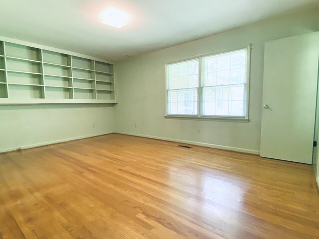 unfurnished room featuring light hardwood / wood-style floors