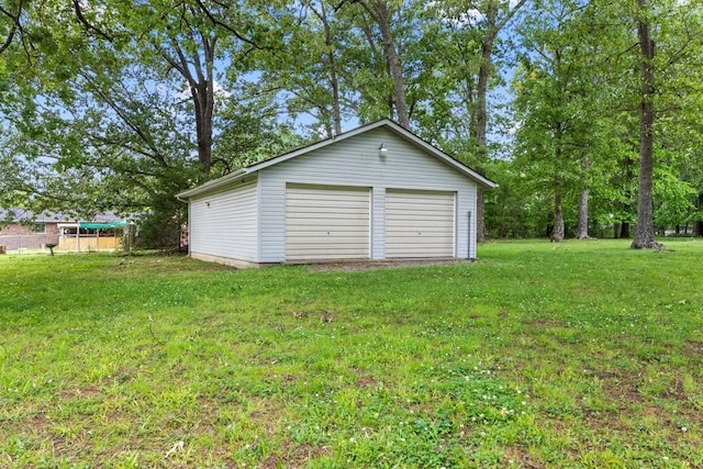 garage with a yard