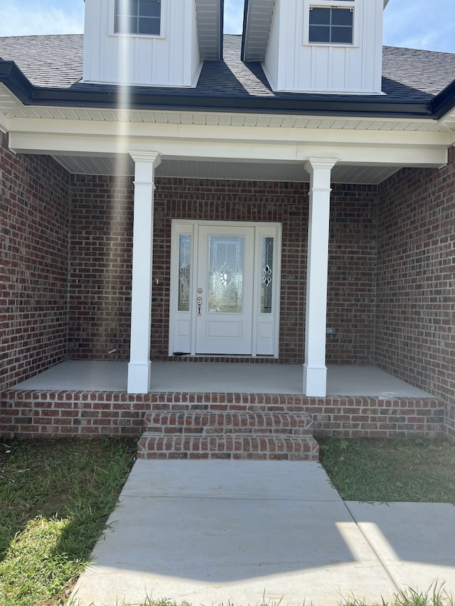 doorway to property featuring covered porch