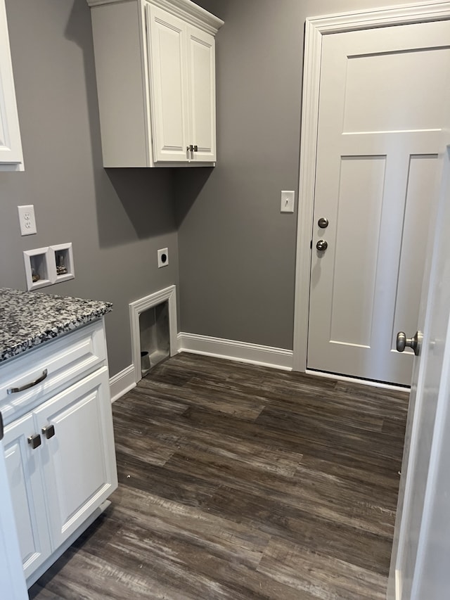 laundry area with cabinets, electric dryer hookup, washer hookup, and dark hardwood / wood-style flooring