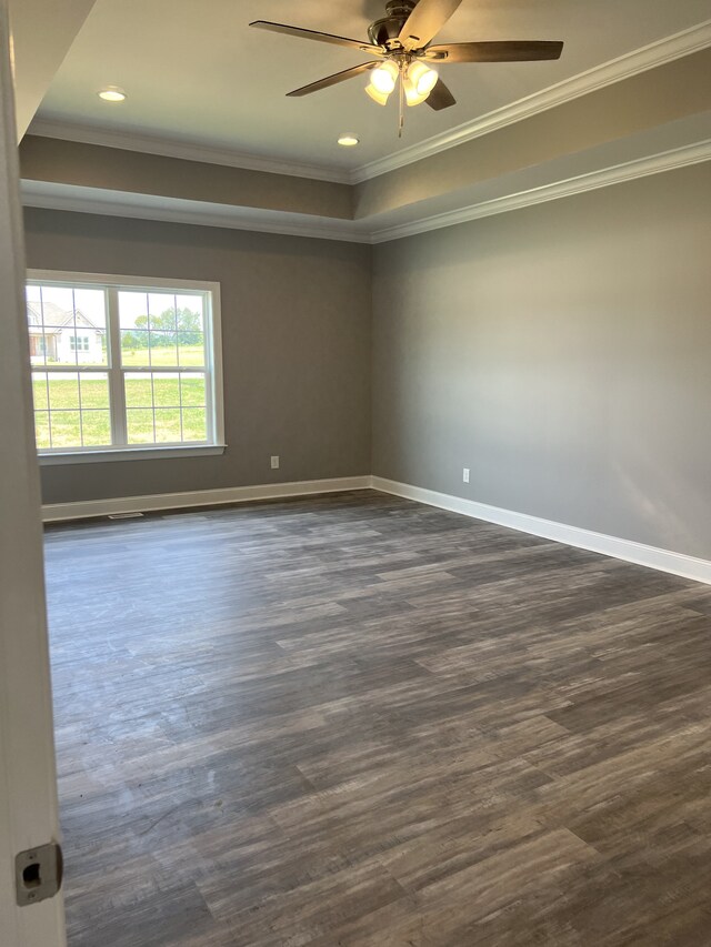 unfurnished room with ceiling fan, ornamental molding, and dark hardwood / wood-style flooring