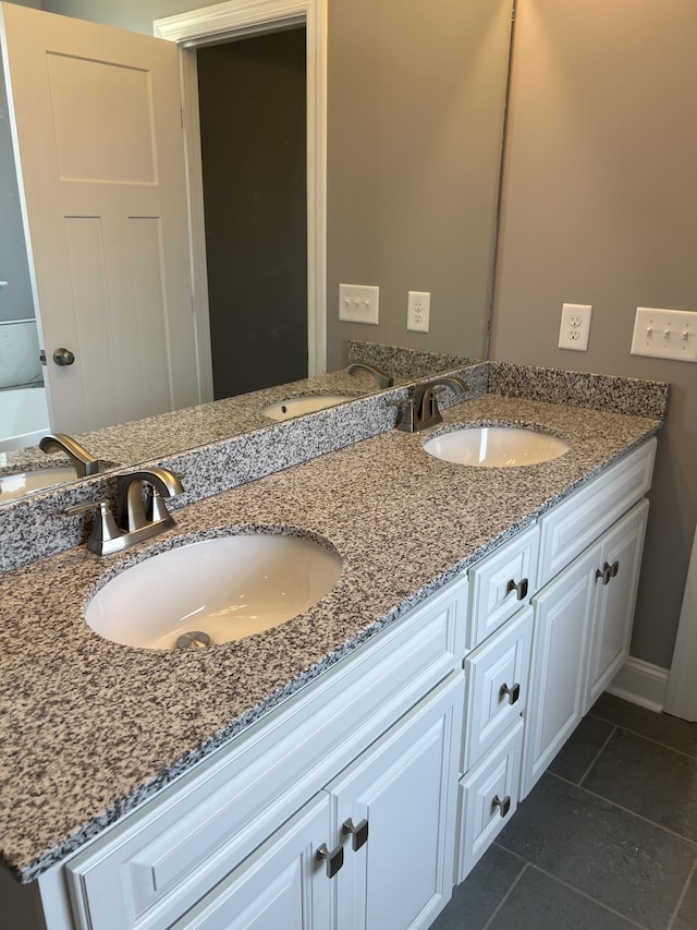 bathroom with vanity and tile patterned floors