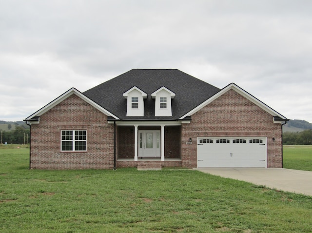 view of front facade with a garage and a front yard