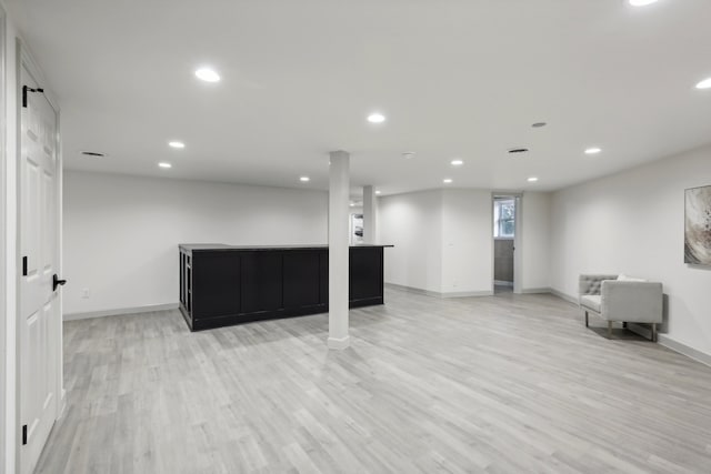 below grade area with baseboards, recessed lighting, and light wood-style floors