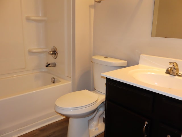 full bathroom with wood-type flooring, vanity, toilet, and shower / bathtub combination