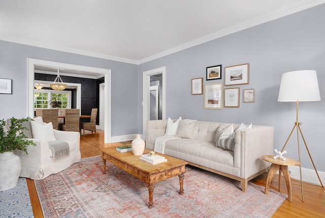 living room featuring crown molding and hardwood / wood-style flooring