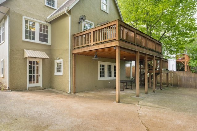 rear view of property with a patio area and a deck