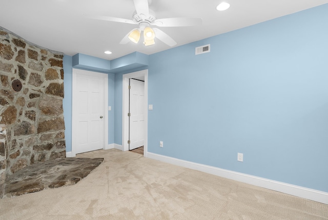 carpeted empty room with ceiling fan