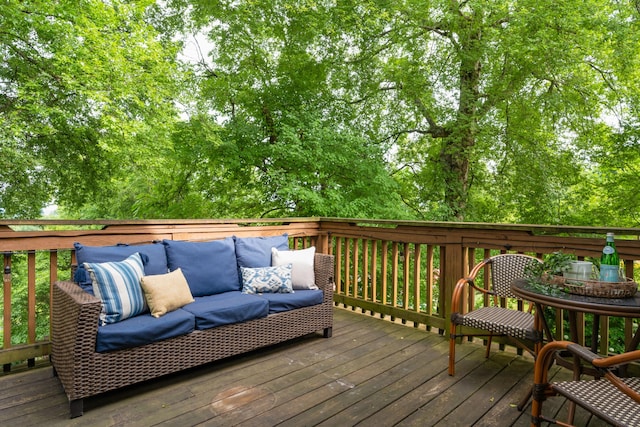 wooden terrace featuring an outdoor hangout area