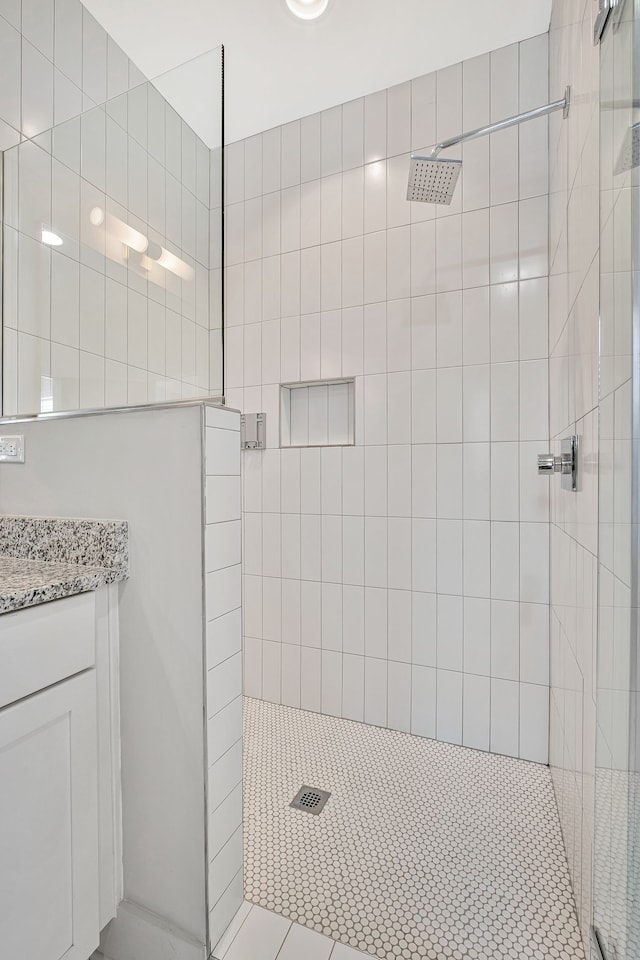 bathroom with a tile shower