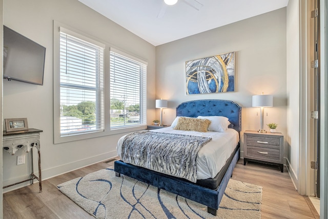 bedroom featuring ceiling fan and light hardwood / wood-style flooring