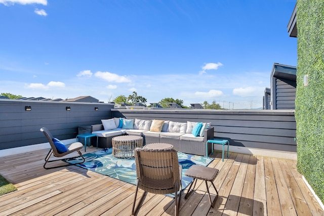 wooden deck featuring an outdoor living space