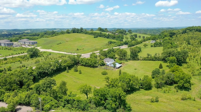 birds eye view of property with a rural view