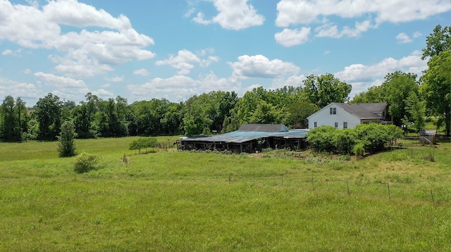 view of yard with a rural view