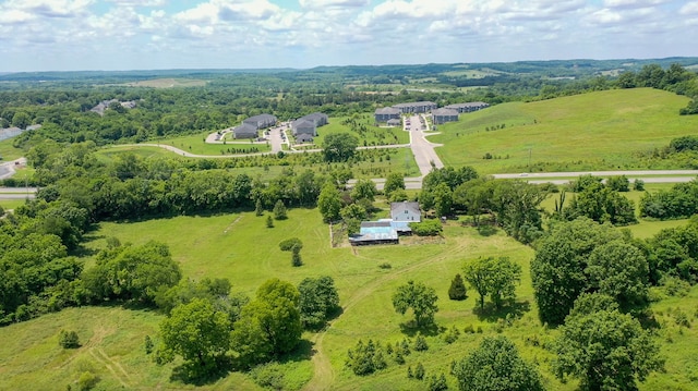 birds eye view of property featuring a rural view