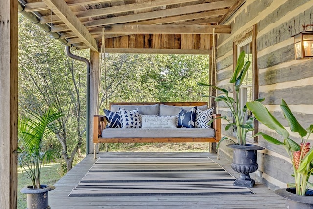 exterior space with an outdoor hangout area and a deck