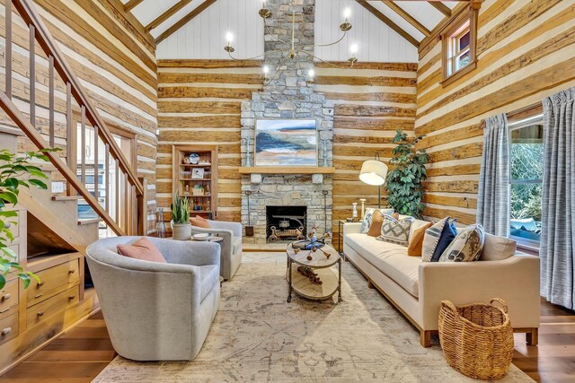 living room featuring high vaulted ceiling, hardwood / wood-style floors, and beamed ceiling