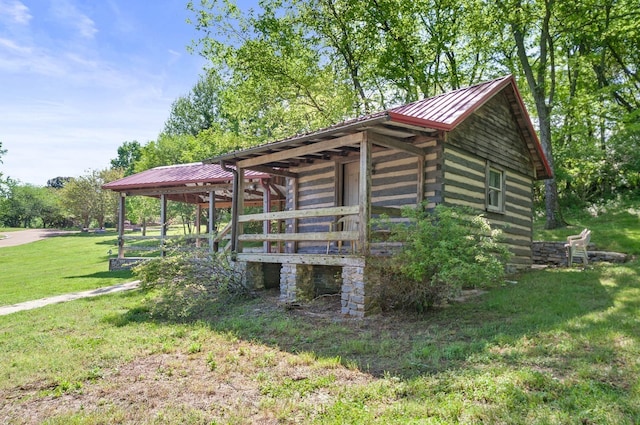 view of outdoor structure featuring a lawn