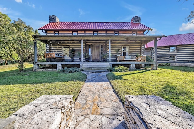 exterior space featuring covered porch and a front lawn